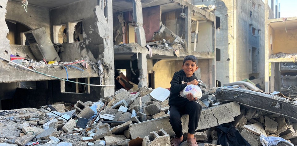 Children carrying their belongings