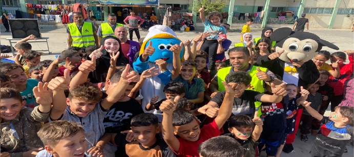 Transformative day for displaced children with Papa Smurf and Mickey Mouse.