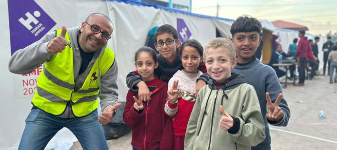 Human Appeal staff members uplift children in Gaza.
