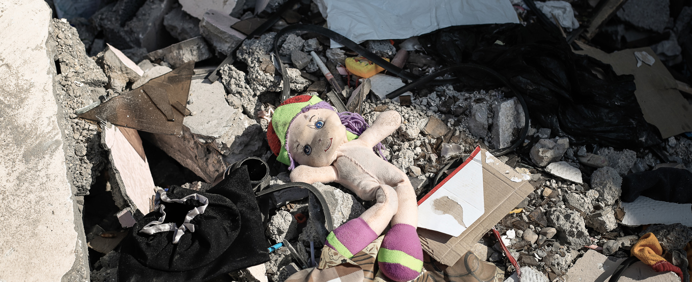 Child's doll left in the rubble